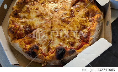 Enjoy a Delicious Cheese Pizza Freshly Made and Awaiting You Right Out of the Box 132741063