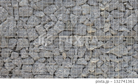 Detailed CloseUp of Gabion Wall Featuring Rock Filling for Various Landscaping Projects 132741361