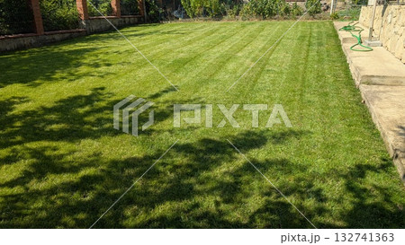 A Beautiful Lush Green Lawn with Freshly Cut Grass Patterns That Captivate the Eye and Spirit 132741363