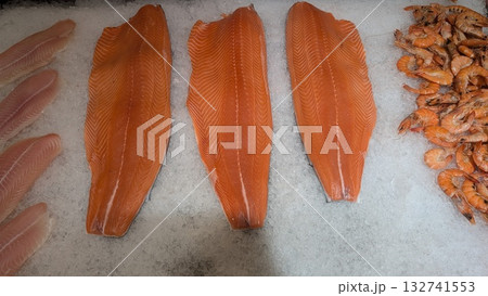 Discover Our Delicious Fresh Seafood Selection Featuring Salmon Fillets and Juicy Shrimps 132741553