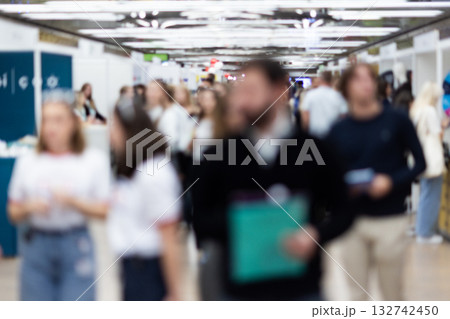 Abstract blurred people at exhibition hall of expo event trade show. Business convention show or job fair. Business concept background. 132742450