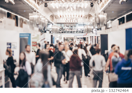 Abstract blurred people at exhibition hall of expo event trade show. Business convention show or job fair. Business concept background. 132742464