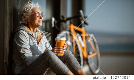 Elderly woman in sporty clothes with bike 132743014