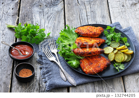 Paprika-Rubbed Pork Chops on a grey plate 132744205