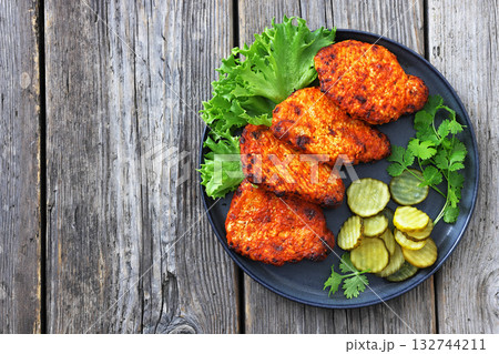 Paprika-Rubbed Pork Chops on a grey plate Paprika-Rubbed Pork Chops on a grey plate 132744211