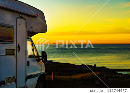 Camper vehicle on beach at sunrise 132744477