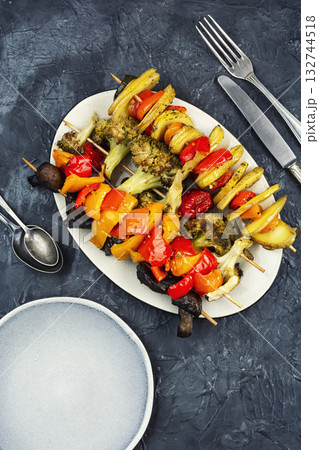 Colorful grilled summer seasonal vegetables skewers. Colorful grilled summer seasonal vegetables skewers. 132744518