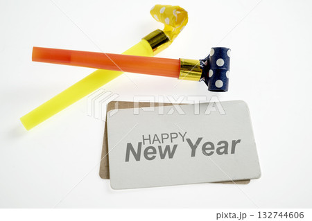 Greeting card of Happy New Year with party blowers. Mockup or Copy space. Happy New Year concept or Celebration Greeting card of Happy New Year with party blowers. Mockup or Copy space. Happy New Year concept or Celebration 132744606