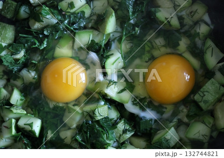 Scrambled eggs with zucchini and herbs. Scrambled eggs with zucchini and herbs. 132744821