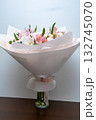 Beautiful bouquet of flowers in woman hand. Floral shop concept . Beautiful fresh cut bouquet. Flowers delivery 132745070