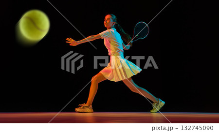 Female tennis player returning fast ball with precision and emotional intensity Female tennis player returning fast ball with precision and emotional intensity 132745090