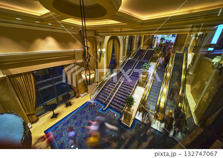 Grand Staircase and Escalator with Motion Blur in Luxury Las Vegas Hotel Interior 132747067