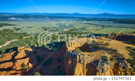 Aerial Red Canyon Cliffs and Green Valley with Arches Trail in Utah Aerial Red Canyon Cliffs and Green Valley with Arches Trail in Utah 132747161