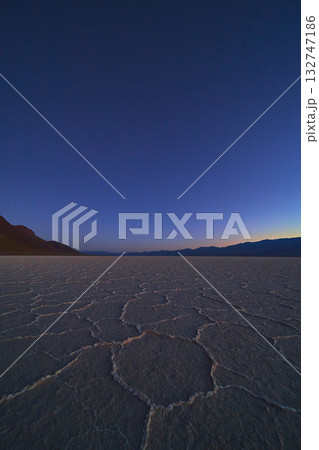 Twilight Salt Flats and Distant Mountains in Death Valley Badwater Basin 132747186