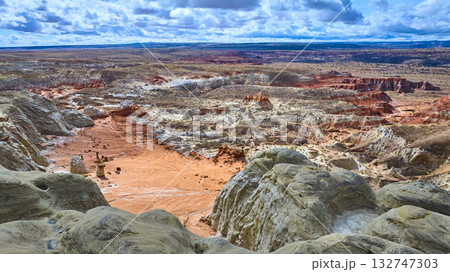 Aerial Badlands and Toadstool Hoodoos Over Colorful Desert Rock Formations 132747303