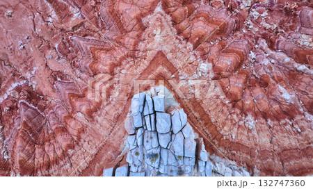 Aerial Red Chevron Rock Layers and Gray Boulders Desert Texture Top Down 132747360