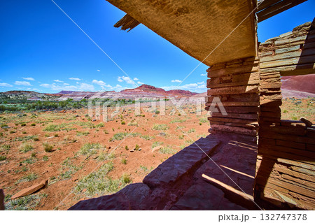 Desert Ruins and Red Rock Mesas in Paria Utah Framed by Old Stone Structure 132747378
