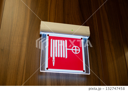 The fire hydrant sign or fire safety sign is used in locations where a fire hydrant, hose, and nozzle are located. The sign can also be used as a pictogram for illuminated signs 132747458
