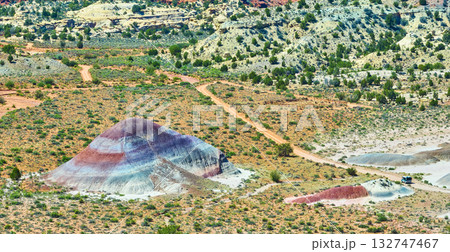 Aerial Colorful Banded Hills and Off Road Vehicle on Movie Road Paria Utah 132747467