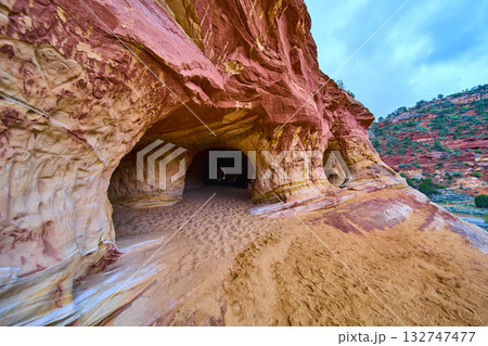 Sandstone Cave Entrance with Swirling Red and Yellow Layers Kanab Utah Desert Sandstone Cave Entrance with Swirling Red and Yellow Layers Kanab Utah Desert 132747477