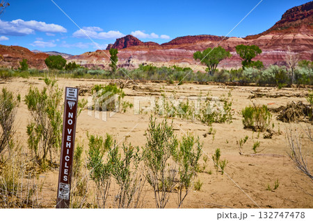 No Vehicles Sign with Red Rock Formations and Desert Vegetation in Paria Utah No Vehicles Sign with Red Rock Formations and Desert Vegetation in Paria Utah 132747478