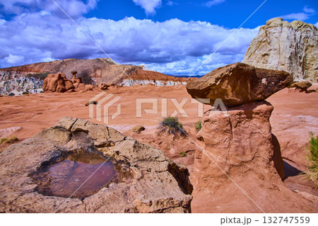 Paria Rimrocks Toadstool Hoodoo with Rainwater Pool and Dramatic Sky Utah 132747559