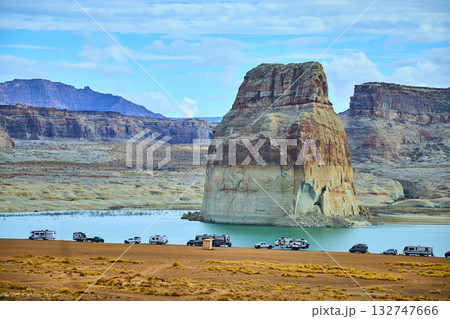 Lone Rock Monolith and RV Campers by Lake Powell Desert Shoreline Lone Rock Monolith and RV Campers by Lake Powell Desert Shoreline 132747666