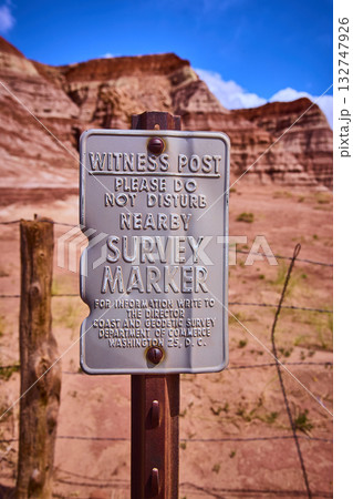 Witness Post Survey Marker Sign in Front of Red Rock Formations Utah Desert 132747926