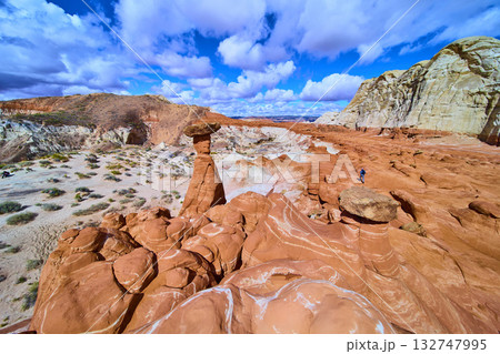 Sandstone Hoodoo and Hiker at Paria Rimrocks Toadstool Hoodoos Utah Desert 132747995