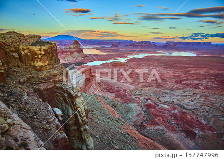 Alstrom Point red rock cliffs and Lake Powell mesas at golden hour Utah desert 132747996