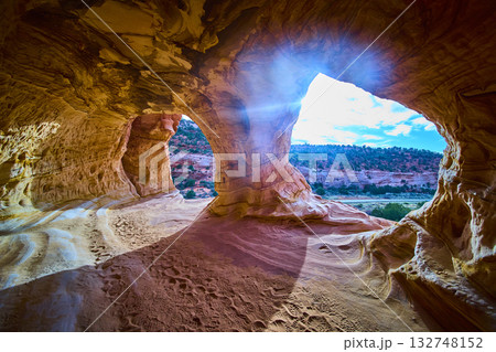 Sandstone Cave Interior with Sunlight and Desert Landscape Kanab Utah 132748152