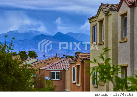 Suburban Las Vegas Homes with Stormy Mountains and Lush Greenery Suburban Las Vegas Homes with Stormy Mountains and Lush Greenery 132748162