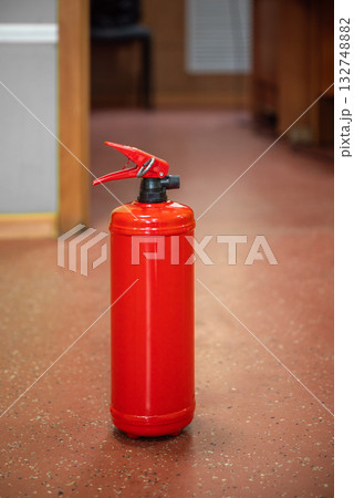 Fire extinguisher in workplace office 132748882