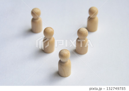 Top view of wooden pegs following a leader 132749785
