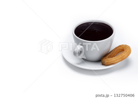 Spanish churros with hot thick chocolate in a white cup Spanish churros with hot thick chocolate in a white cup 132750406