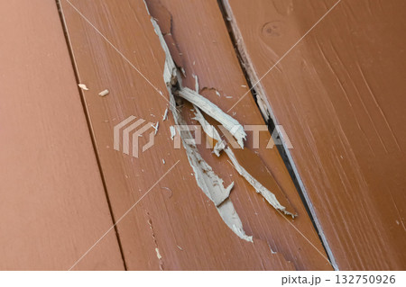 The floorboards are cracked from dampness. Crack in the floor The floorboards are cracked from dampness. Crack in the floor 132750926