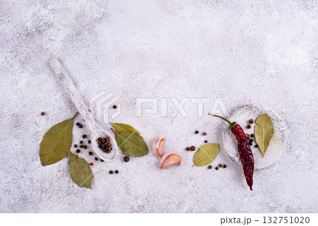 Culinary background with pepper, bay leaf and garlic 132751020