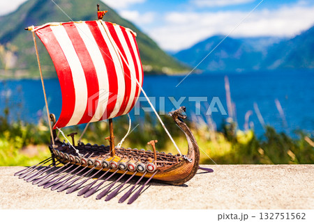 Viking boat on fjord shore, Norway 132751562