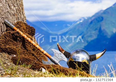 Viking helmet on fjord shore, Norway Viking helmet on fjord shore, Norway 132751564