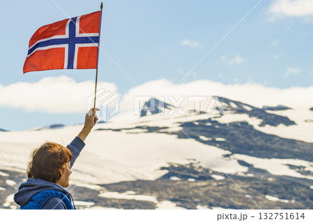 Tourist with norwegian flag in mountains Tourist with norwegian flag in mountains 132751614