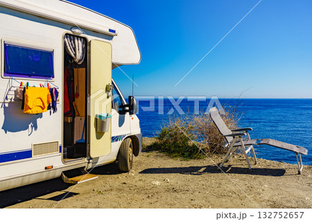 Camper rv on sea with clothes to dry 132752657