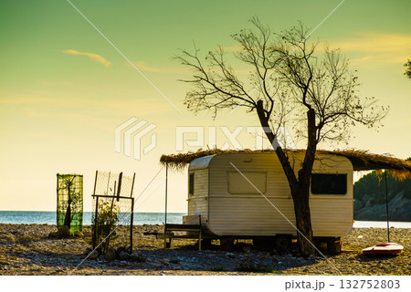Caravan trailer on sunny beach 132752803