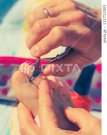 Woman trimming cuticles before pedicure 132752805