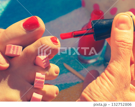 Woman pedicure with red nail polish Woman pedicure with red nail polish 132752806