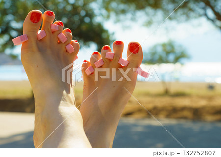 Woman drying her nail polish after pedicure 132752807