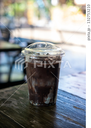 Iced mint chocolate with whipped cream on wooden table Iced mint chocolate with whipped cream on wooden table 132753210