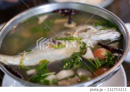 Mackerel tom yum, a spicy and sour Thai soup featuring mackerel, herbs, and aromatic spices. Mackerel tom yum, a spicy and sour Thai soup featuring mackerel, herbs, and aromatic spices. 132753211