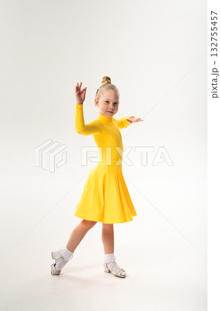 Young dancer with cochlear implant performing dance pose. Strength, adaptability, and inclusion merge in a story of overcoming hearing barriers through art, discipline, and body control. Young dancer with cochlear implant performing dance pose. Strength, adaptability, and inclusion merge in a story of overcoming hearing barriers through art, discipline, and body control. 132755457
