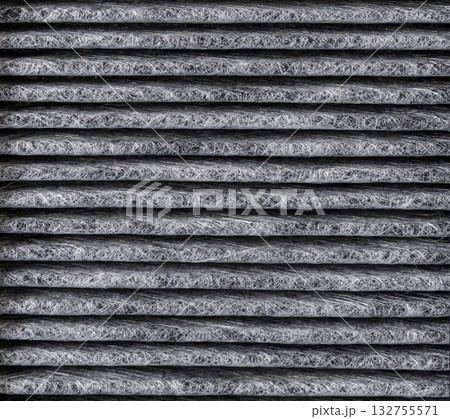 The replaced car air filter shows a clear contrast, with the air intake side appearing dirtier than the cleaner air outlet side. The replaced car air filter shows a clear contrast, with the air intake side appearing dirtier than the cleaner air outlet side. 132755571
