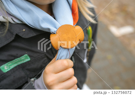 Boy Scout Anniversary Week, Scout Sunday, Scout Sabbath Young caucasian girl with scouting uniform and neckerchief slide 132756072